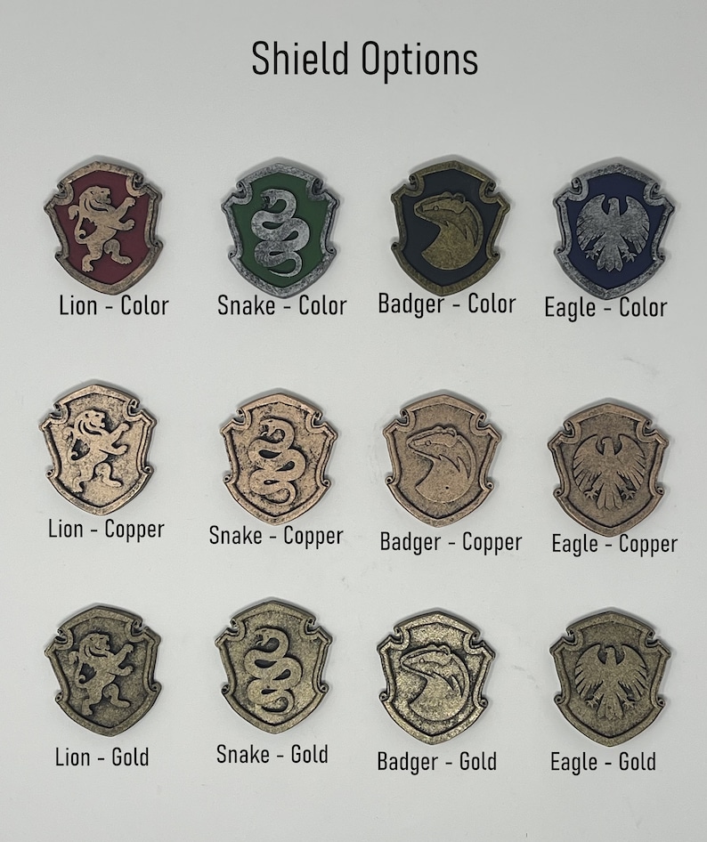 May include: Nine different shield designs, each featuring a different animal: a lion, a snake, a badger, and an eagle. Each animal is shown in three different finishes: colour, copper, and gold.