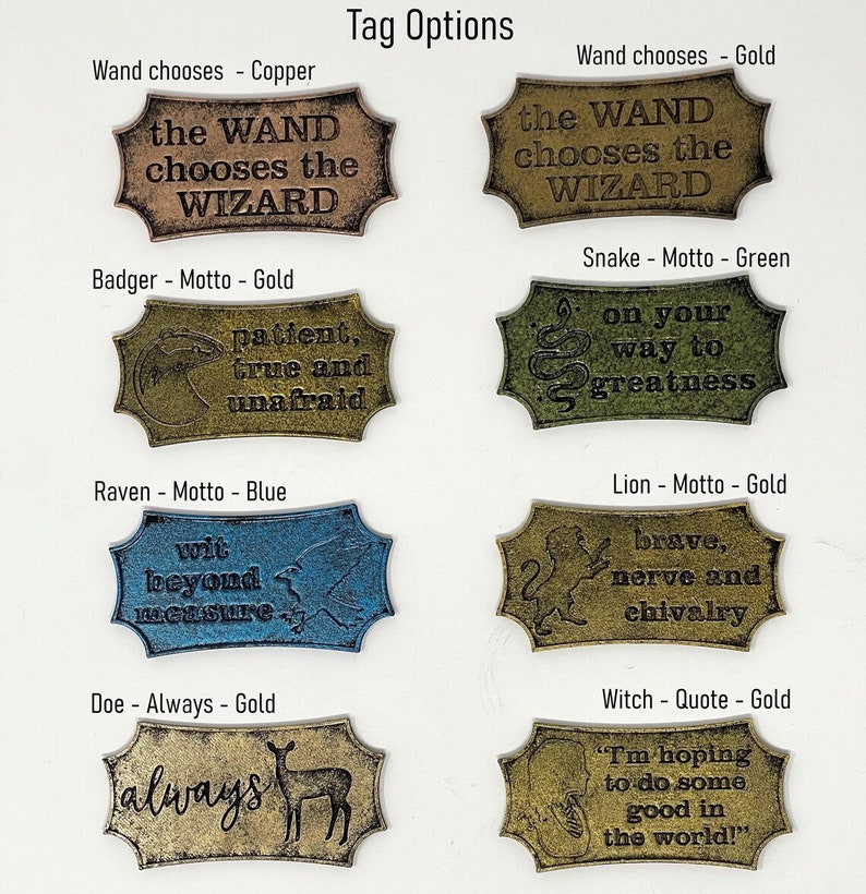May include: Nine different metal tags with various designs and sayings. The tags are in different colours, including gold, copper, green, and blue. The tags feature sayings like "the wand chooses the wizard", "patient, true and unafraid", "wit beyond measure", "always", "on your way to greatness", "brave, nerve and chivalry", and "I'm hoping to do some good in the world!"