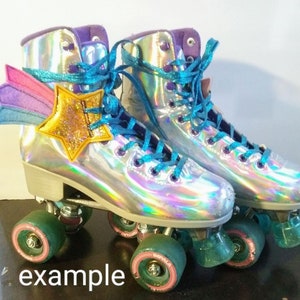 May include: A pair of iridescent roller skates with teal laces and a rainbow star and wing applique. The wheels are green and pink.