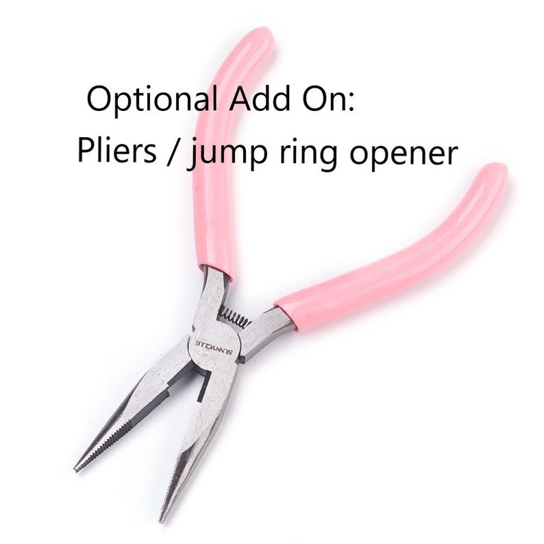 May include: Pink handled pliers with a silver metal head. The pliers are labeled "S.N.W.O.T.L.E."