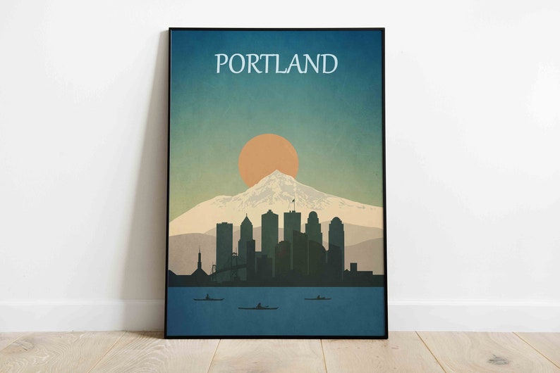 May include: A retro-style poster featuring a cityscape silhouette of Portland, Oregon, with Mount Hood and a setting sun. The poster has a blue, green, and orange colour scheme and the text "PORTLAND" at the top.