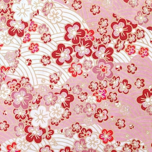 May include: A pink and white patterned paper with a repeating design of red and pink flowers. The pattern is reminiscent of Japanese cherry blossoms.