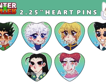May include: Six 2.25 inch heart-shaped pins featuring characters from the anime Hunter x Hunter. The characters are Gon, Killua, Kurapika, Leorio, Hisoka, and Illumi. Each pin has a green, blue, or pink background.