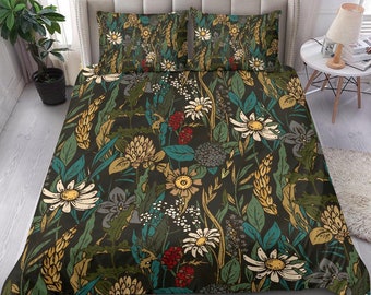 May include: A dark green duvet cover with a floral pattern featuring white, yellow, and red flowers. The duvet cover has a matching set of pillowcases.