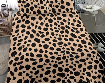 Puede incluir: Un juego de cama de estampado de leopardo marrón y negro con dos fundas de almohada y una funda nórdica.