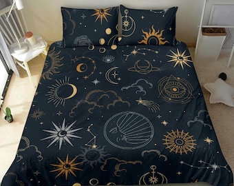 May include: A dark blue duvet cover with a celestial pattern featuring moons, stars, and suns in gold and white. The duvet cover is made of soft, comfortable fabric and is perfect for adding a touch of whimsy to any bedroom.
