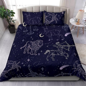 May include: A navy blue duvet cover with a constellation pattern featuring zodiac signs, stars, and crescent moons. The signs include Leo, Sagittarius, Libra, and Cancer.