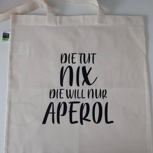 Personalized shopping bag made of organic cotton in the color natural "She doesn't do anything, she just wants Aperol/Lillet/Baileys/Shopping" - Valentine's Day