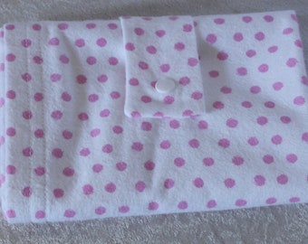 May include: White fabric baby burp cloth with pink polka dots and a white snap closure.