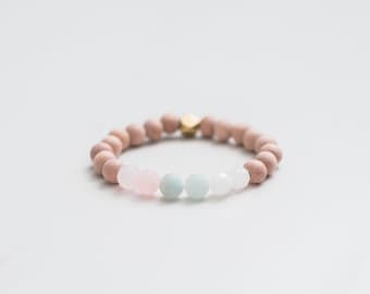 Pulsera de fertilidad con piedras preciosas: cuarzo rosa, piedra lunar y difusor de madera