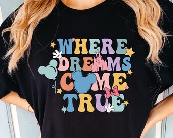 May include: Black oversized t-shirt with a colorful graphic that says "Where Dreams Come True" with Mickey Mouse ears, a castle, and stars.