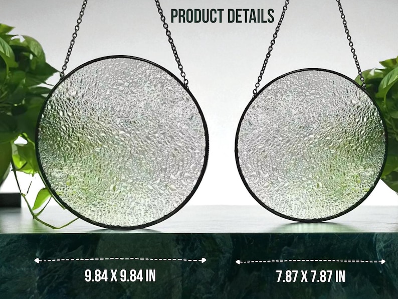 May include: Two circular, textured glass suncatchers with black metal frames and hanging chains. The larger one measures 25 x 25 cm, and the smaller one is 20 x 20 cm. The text "PRODUCT DETAILS" is visible at the top.