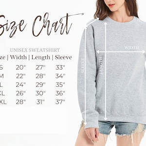 May include: Unisex sweatshirt size chart with measurements in inches for width, length, and sleeve length. Sizes include S, M, L, XL, and 2XL.