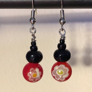 Red Millefiori beads with white and yellow flower centers & black round bead pierced earrings