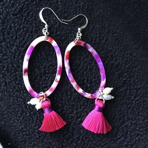 Pink, purple and white open acetate oval design pierced earrings with tiny pearls and pink tassels