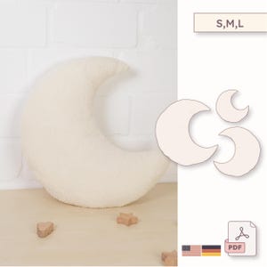 Pode incluir: Uma almofada em forma de meia-lua creme, feita de um tecido macio e texturizado. A almofada está ao lado de três modelos de meia-lua em tamanhos diferentes. O texto "S,M,L" está acima dos modelos.