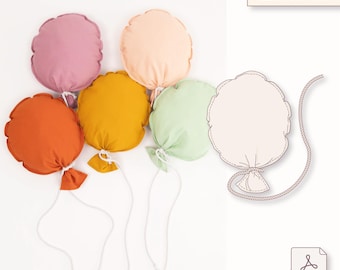 May include: Five colorful, round fabric balloons in shades of orange, yellow, pink, peach, and green, each with a white string and a small fabric bow. The image also includes a balloon template and the text "22 x 30 cm".