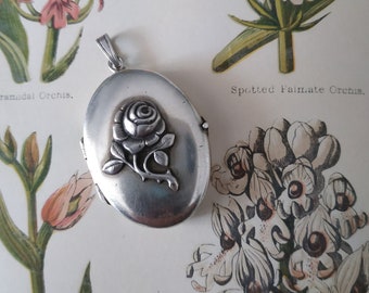 Antique Art Deco 835 sterling silver Rose locket pendant. Engraved on the back with letter E.