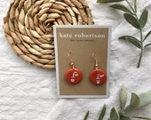 Circular Terracotta Polymer Clay Drop Earrings with White Painted Abstract Face