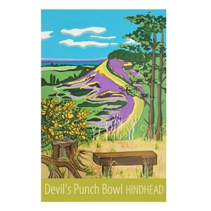 May include: A painting of a landscape with a purple hill, a green field, a yellow bush, a wooden bench, and a tree. The text "Devil's Punch Bowl Hindhead" is at the bottom of the painting.