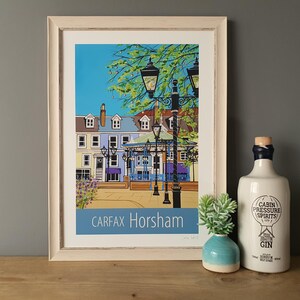 Horsham Carfax travel poster print in white frame by Susie West