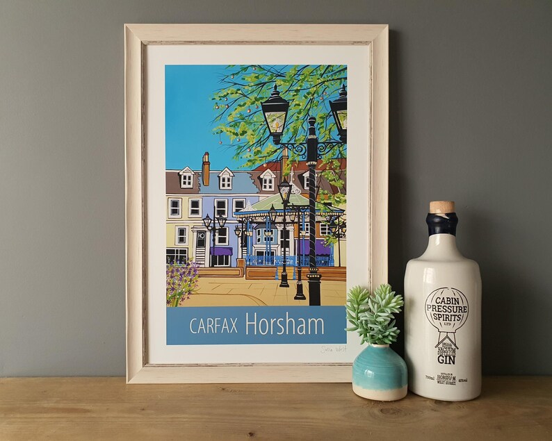 Horsham Carfax travel poster print in white frame by Susie West