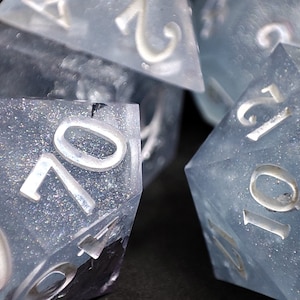 Ghostly Frost: handmade 7 piece resin dice set with silver foil frozen blue shimmers white winter for dnd pathfinder ttrpg