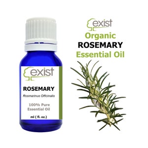 May include: A blue glass bottle with a white cap, labeled "exist Organic Rosemary Essential Oil". The bottle contains 100% pure rosemary essential oil. The label also includes the botanical name "Rosmarinus Officinalis". A sprig of rosemary is shown in the background.
