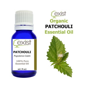 May include: A blue glass bottle with a white cap, labelled "Exist Organic Patchouli Essential Oil". The bottle contains 100% pure patchouli essential oil. The label also includes the botanical name "Pogostemon Cablin". A green patchouli leaf is shown in the background.