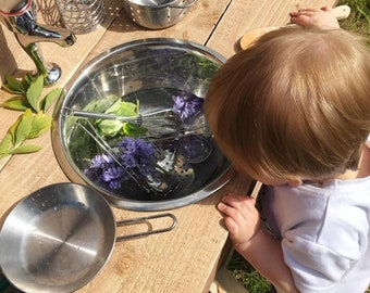 Mud kitchen with working tap, cupboard and chalkboard