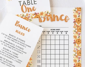 May include: Bunco game cards with a seasonal autumn design. The set includes a table number, rules, and a score sheet. The cards feature a white background with orange and yellow fall foliage and pumpkin accents. The word "Bunco" is in orange.