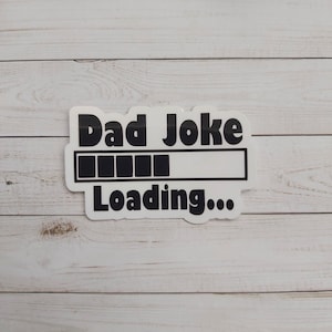 May include: White sticker with black text that reads "Dad Joke Loading..." with a progress bar that is almost full.