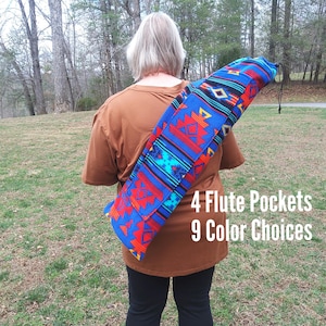May include: A cylindrical carrying case for flutes featuring a vibrant blue, red, and orange geometric pattern. The bag has a drawstring closure and is worn over the shoulder. Text on the image reads: 4 Flute Pockets, 9 Color Choices.