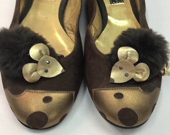 Brown vintage Beverly Feldman flats with mink pompoms