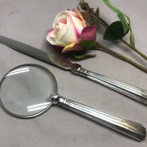 Antieke, sterling zilveren briefopener en vergrootglasset met het kenmerk Sheffield 1916. Ideaal cadeau en bureauaccessoire