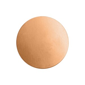 May include: A solid, round, copper-colored metal disc. The disc has a brushed texture and a slightly reflective surface. The object is isolated on a white background, highlighting its shape and color.