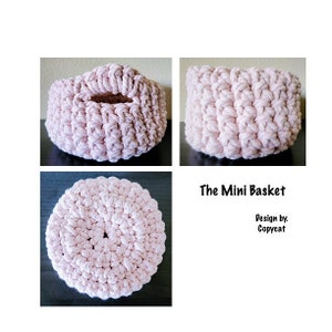 May include: A pink crocheted mini basket with a handle. The basket is made with a single crochet stitch and has a round shape. The text "The Mini Basket" and "Design by. Copycat" is visible in the image.