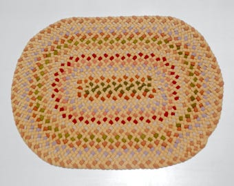 Braided rug, crafted by hand, one of a kind, wool, oval 24 x 33", yellow and pastels.