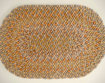 Braided rug, hand braided, one of a kind, oval shape 30" x 21", beige/butterscotch/orange, wool fabric.