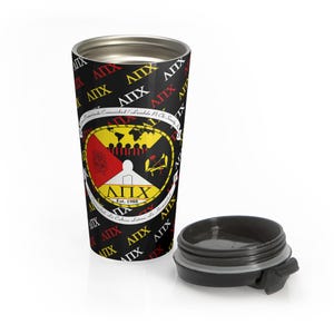 May include: Black travel mug with a repeating pattern of the letters "ΑΠΧ" in white, yellow, and red. The mug features a central emblem with a red, yellow, and black design and the text "ΑΠΧ Est. 1988". The lid is black.