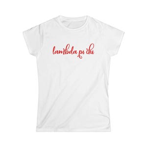 May include: A white t-shirt featuring the red cursive text "lambda pi chi". The top has a crew neck and is made from a soft fabric.