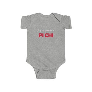 May include: A light grey baby bodysuit featuring the text "My mommy is a PI CHI" in red and white. The garment is made of a soft material and has short sleeves.