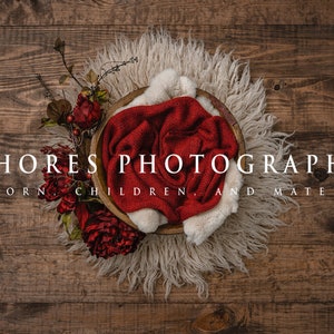 May include: A wooden bowl with a red blanket inside, surrounded by a white fluffy rug and red flowers. The text "SHORES PHOTOGRAPHY NEWBORN, CHILDREN, AND MATERNITY" is displayed below the bowl.