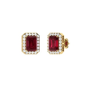 May include: A pair of gold earrings with a red emerald-cut gemstone surrounded by a halo of smaller white gemstones.