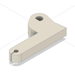 May include: A light beige, L-shaped mechanical component with a flat, solid surface. One end features a circular hole, while the other end has a smaller circular hole with a narrow vertical slit extending to the outer edge of the piece.