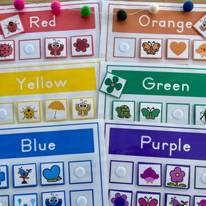 May include: A set of five color matching cards with different images on each card. The colors are red, orange, yellow, green, and blue. Each card has a title with the color name and a grid of images. The images include a ladybug, butterfly, flower, umbrella, turtle, grasshopper, flower, bird, and a heart.