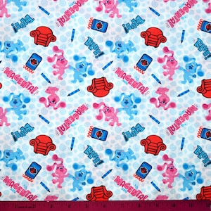 May include: Blue and magenta cartoon dogs with the words "Blue!" and "Magenta!" on a white background with blue and red accents. The dogs are wearing red and blue shirts and have a playful expression.