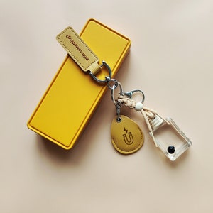 Rich and Colourful ferrofluid display bottle keychain charm with spiky effect.