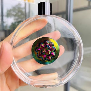 gradient colorful Ferrofluid in a bottle, magnetic display desk toy, DIY audio visualizer solution provider. speaker music companion.