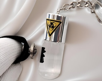 Biohazard und Venom kombinierte Ferroflüssigkeit Schlüsselanhänger